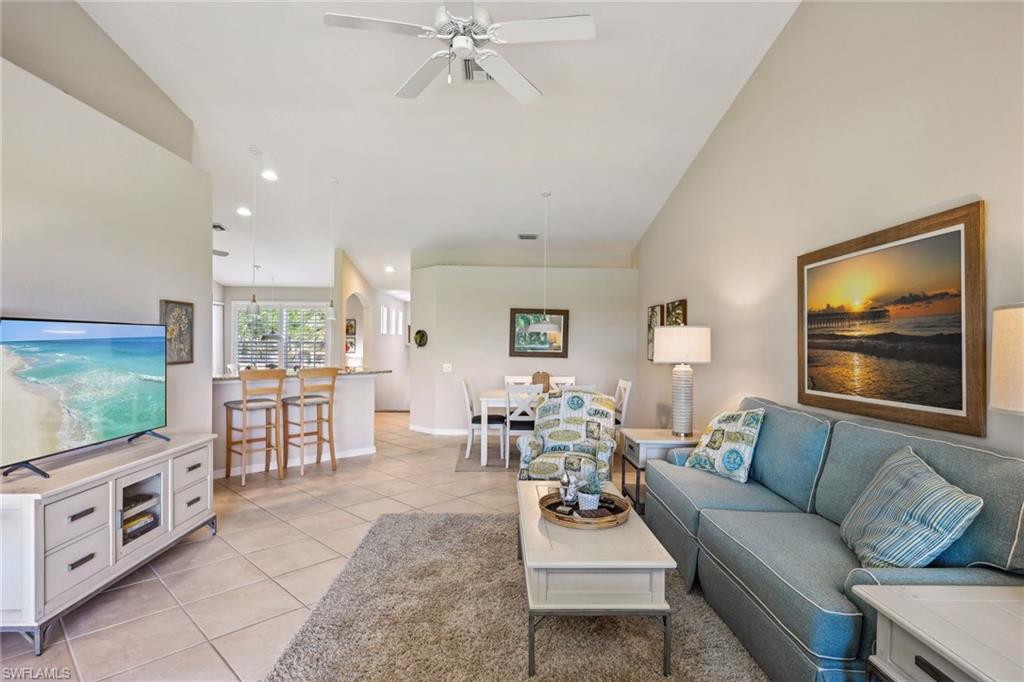 9030 Spring Run Boulevard, Unit 508 Estero, FL 34135 - Photo 20 of 50 a living room with furniture and a flat screen tv