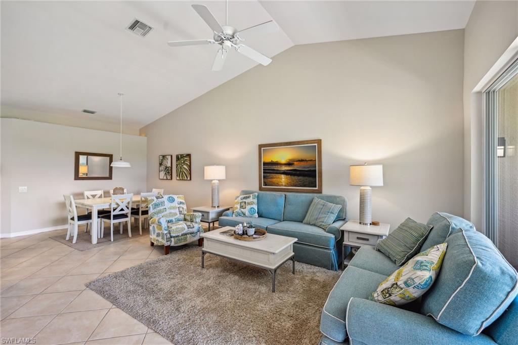 9030 Spring Run Boulevard, Unit 508 Estero, FL 34135 - Photo 21 of 50 a living room with furniture and a flat screen tv