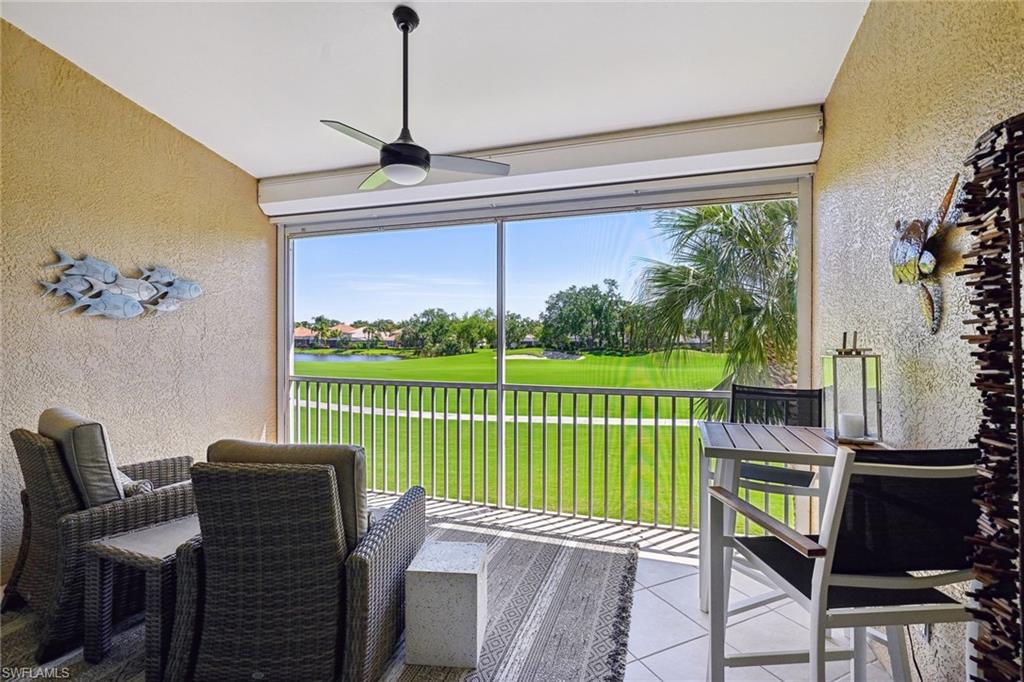 9030 Spring Run Boulevard, Unit 508 Estero, FL 34135 - Photo 30 of 50 a view of a patio with a table chairs and a garden