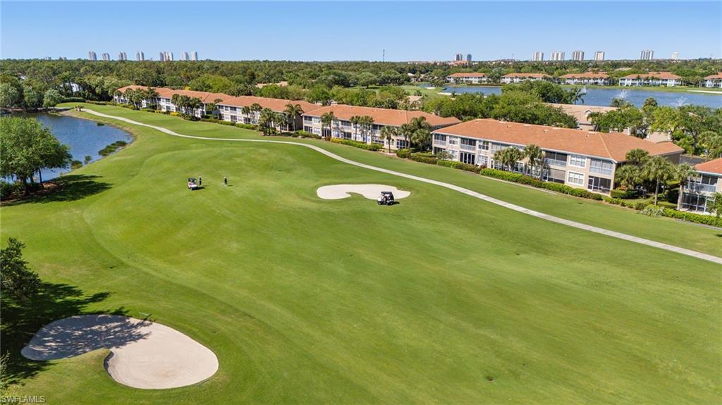 9030 Spring Run Boulevard, Unit 508 Estero, FL 34135 - Photo 34 of 50 an aerial view of residential houses with outdoor space and river
