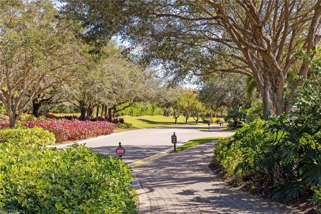 9030 Spring Run Boulevard, Unit 508 Estero, FL 34135 - Photo 43 of 50 a view of a pathway with a yard