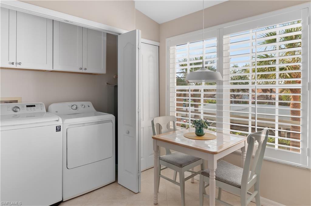 9030 Spring Run Boulevard, Unit 508 Estero, FL 34135 - Photo 10 of 50 a view of a dining room with furniture and windows