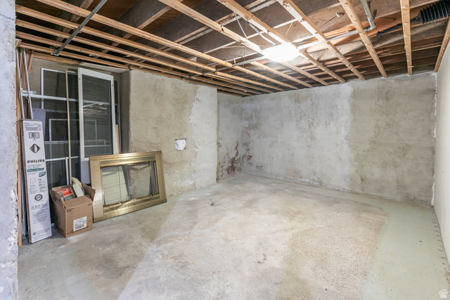 59 East Pinehurst Street Tooele, UT 84074 - Photo 15 of 22 Unfinished basement space with exposed ceiling joists and a concrete floor