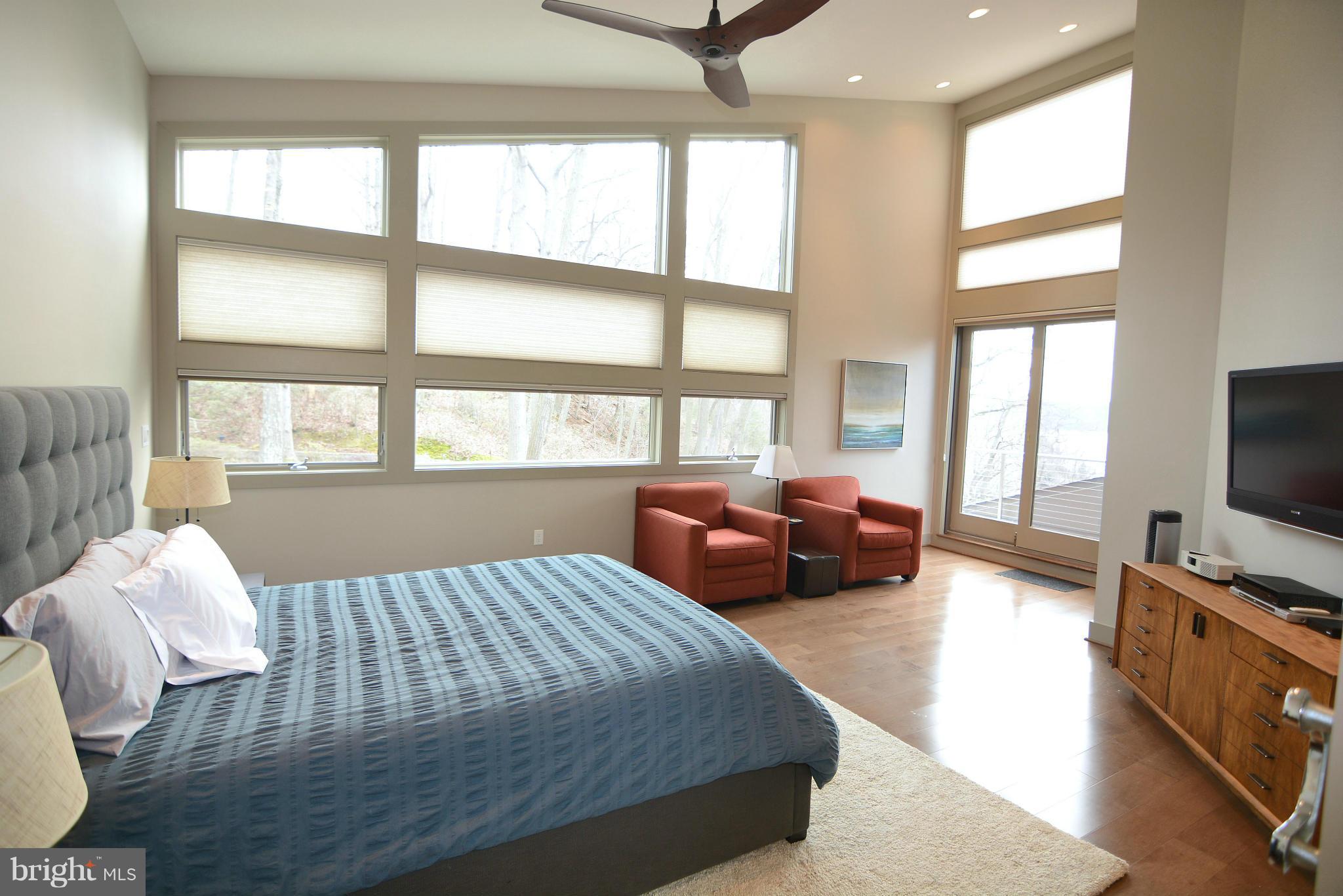 1252 Fenwick Garth Arnold, MD 21012 - Photo 10 of 30 a bedroom with furniture and a flat screen tv