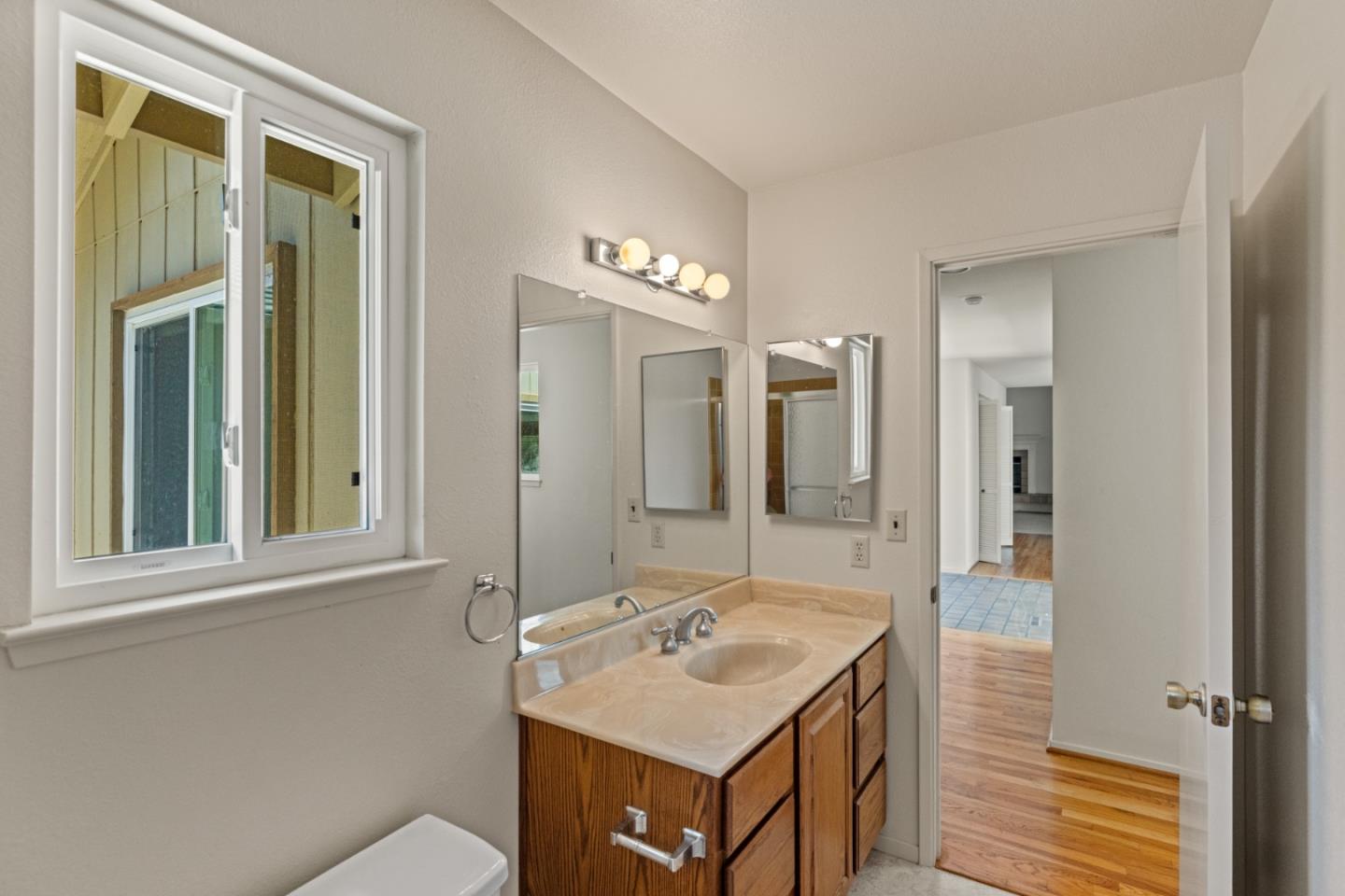 14220 Mountain Quail Road Salinas, CA 93908 - Photo 22 of 74 a bathroom with a sink and a mirror
