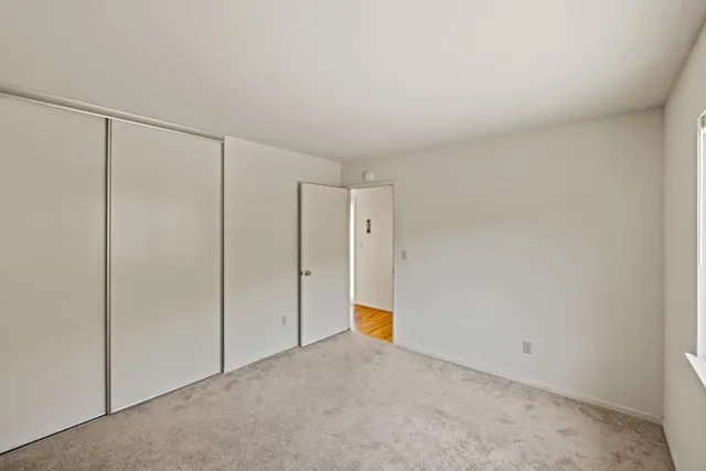 a view of a dining room with furniture wooden floor and a chandelier