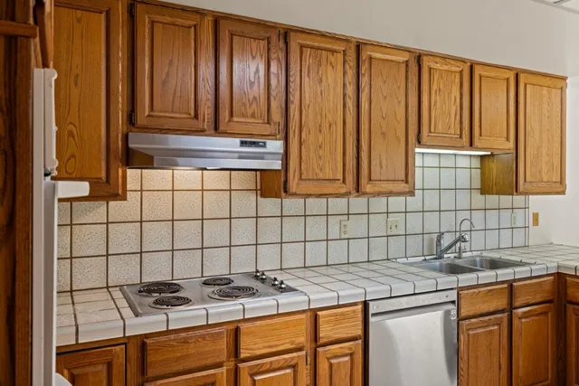 a view of house with outdoor space and swimming pool