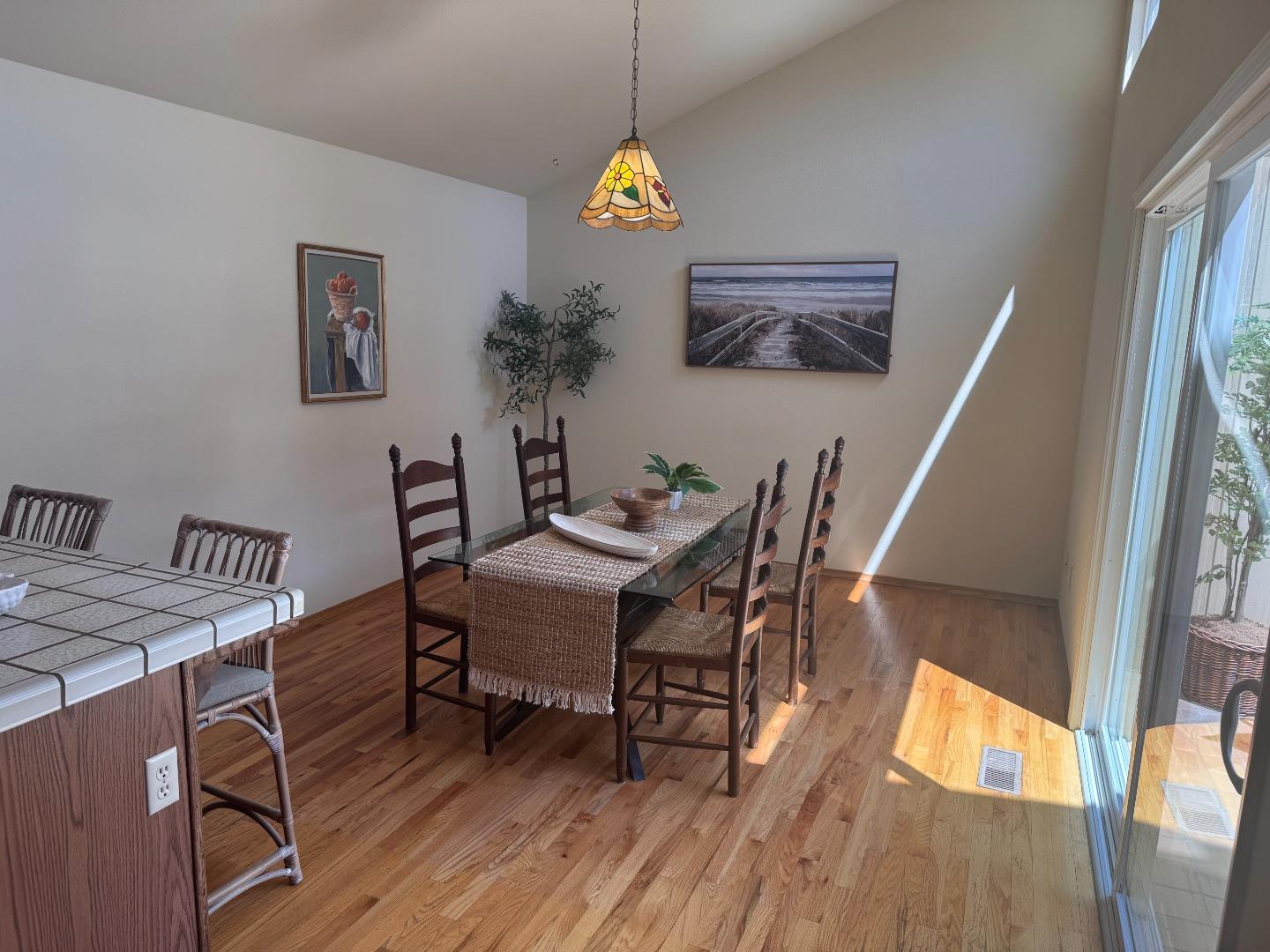 14220 Mountain Quail Road Salinas, CA 93908 - Photo 46 of 74 a view of a dining room with furniture window and wooden floor