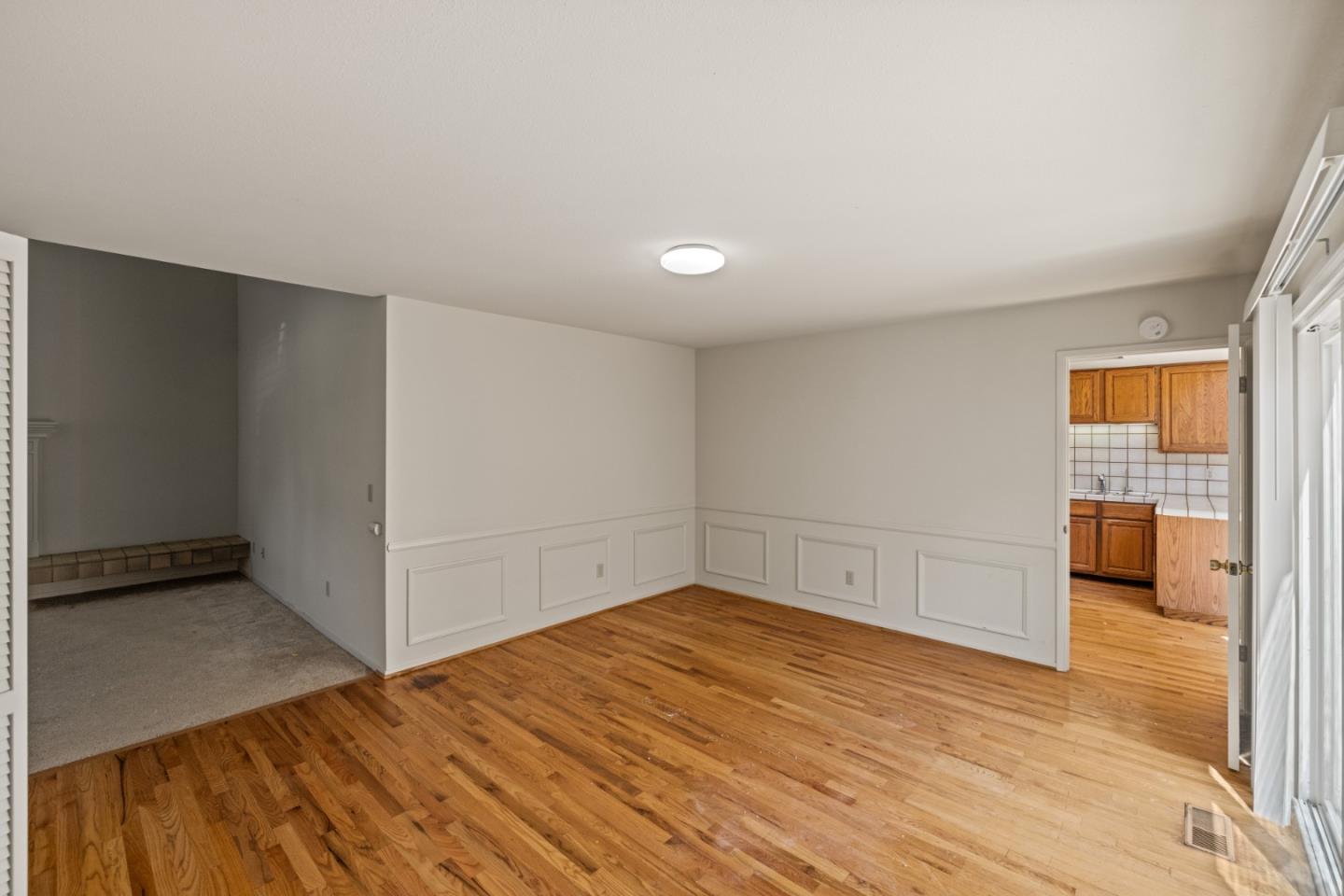 14220 Mountain Quail Road Salinas, CA 93908 - Photo 49 of 74 a view of empty room with wooden floor and fan
