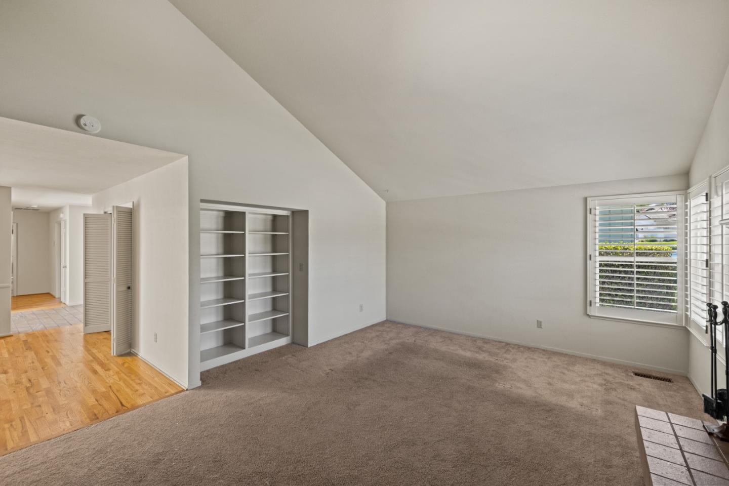 14220 Mountain Quail Road Salinas, CA 93908 - Photo 54 of 74 a view of an empty room with wooden floor and windows
