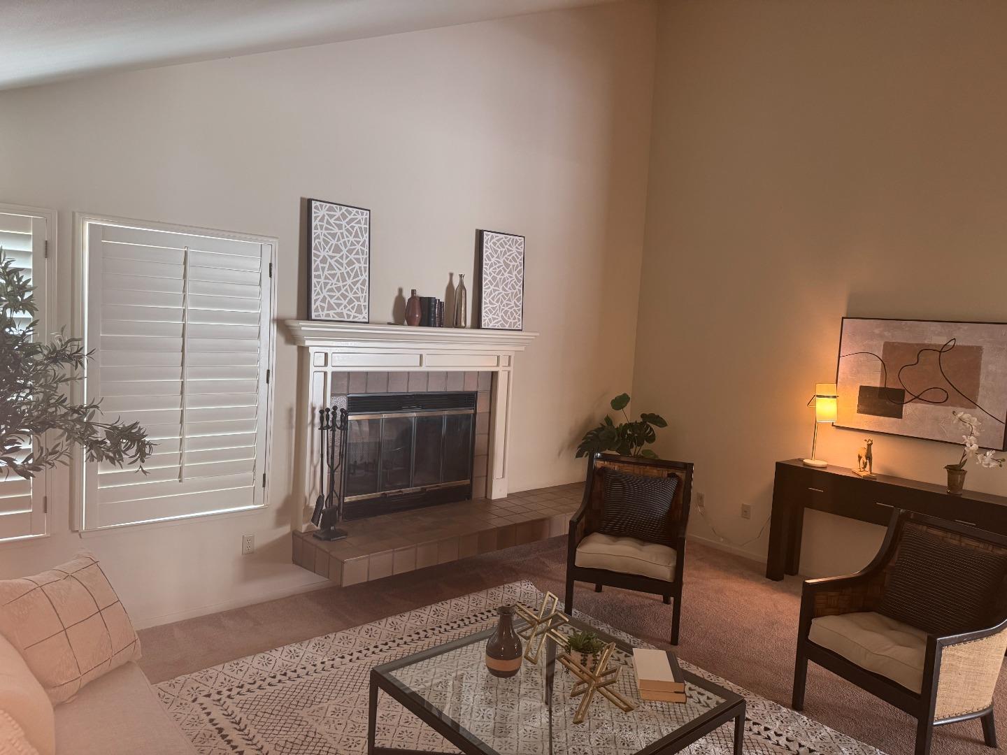 14220 Mountain Quail Road Salinas, CA 93908 - Photo 59 of 74 a living room with furniture and a fireplace