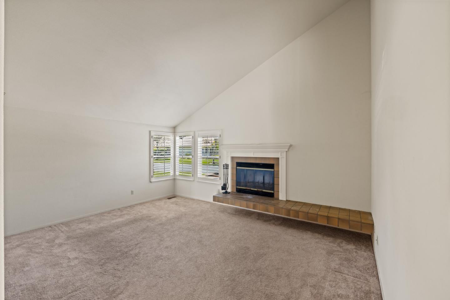 14220 Mountain Quail Road Salinas, CA 93908 - Photo 60 of 74 a view of an empty room with a fireplace and a window