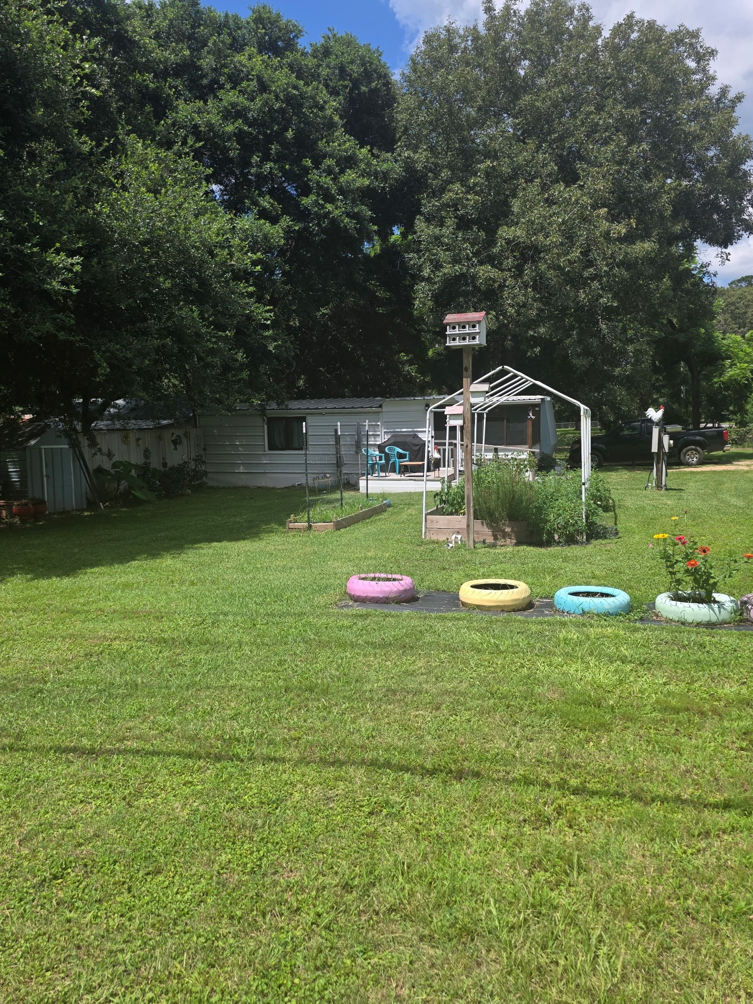 11 Pine Road Coldspring, TX 77331 - Photo 1 of 32 a front view of a house with garden