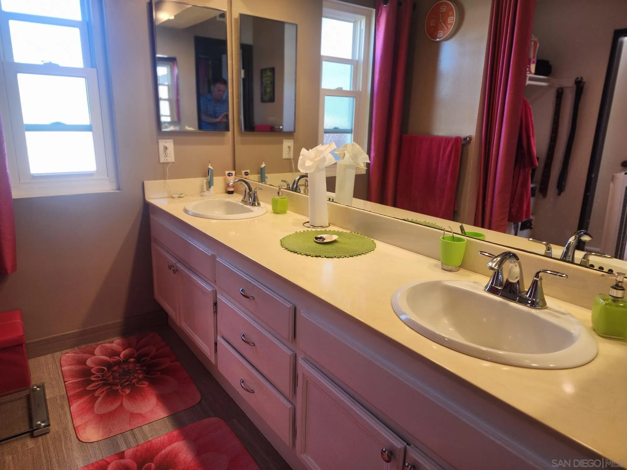 2332 Summerhill Drive Encinitas, CA 92024 - Photo 11 of 28 a bathroom with a granite countertop double vanity sink and a mirror