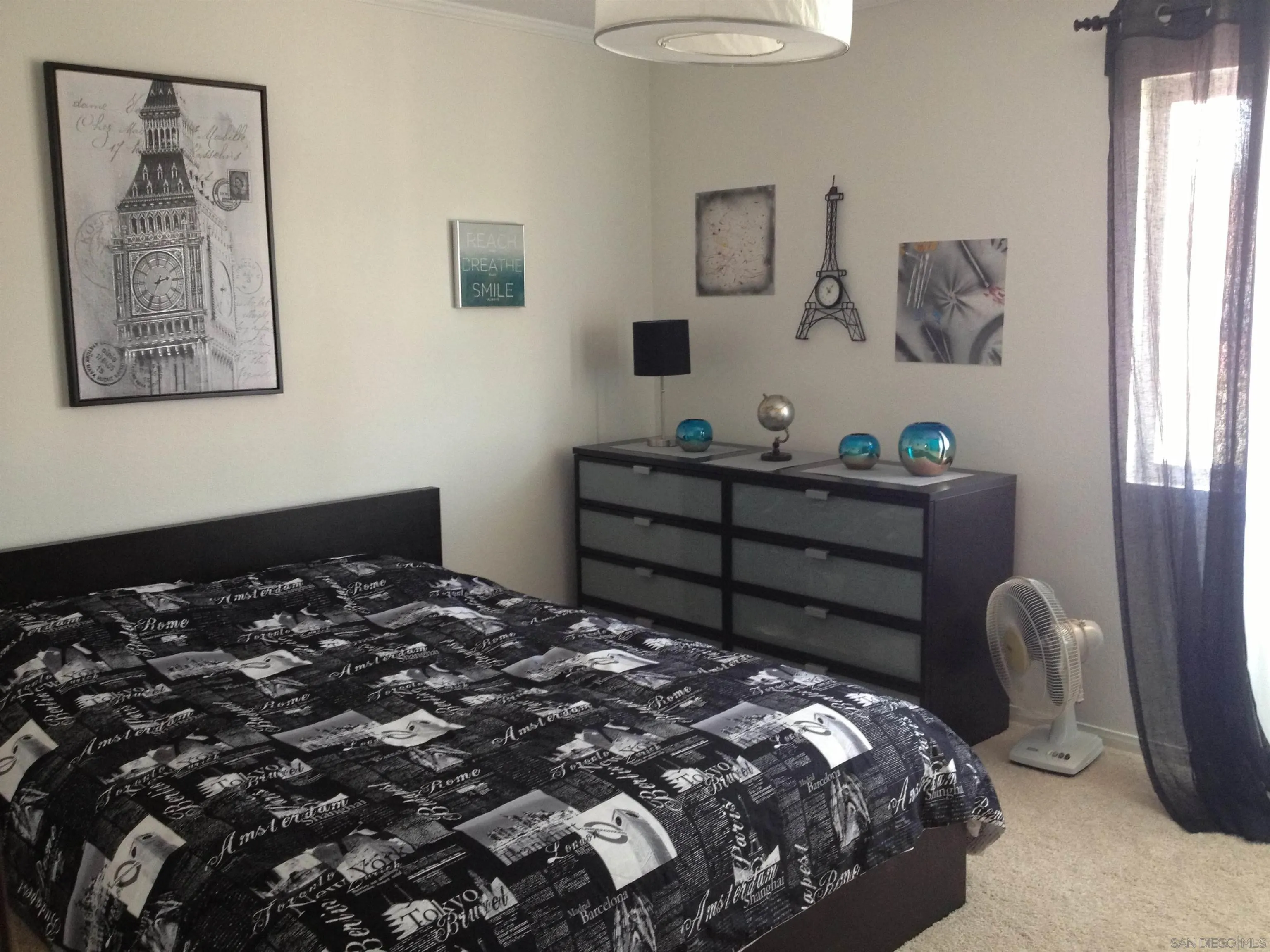 2332 Summerhill Drive Encinitas, CA 92024 - Photo 8 of 28 a bedroom with a bed and a chandelier