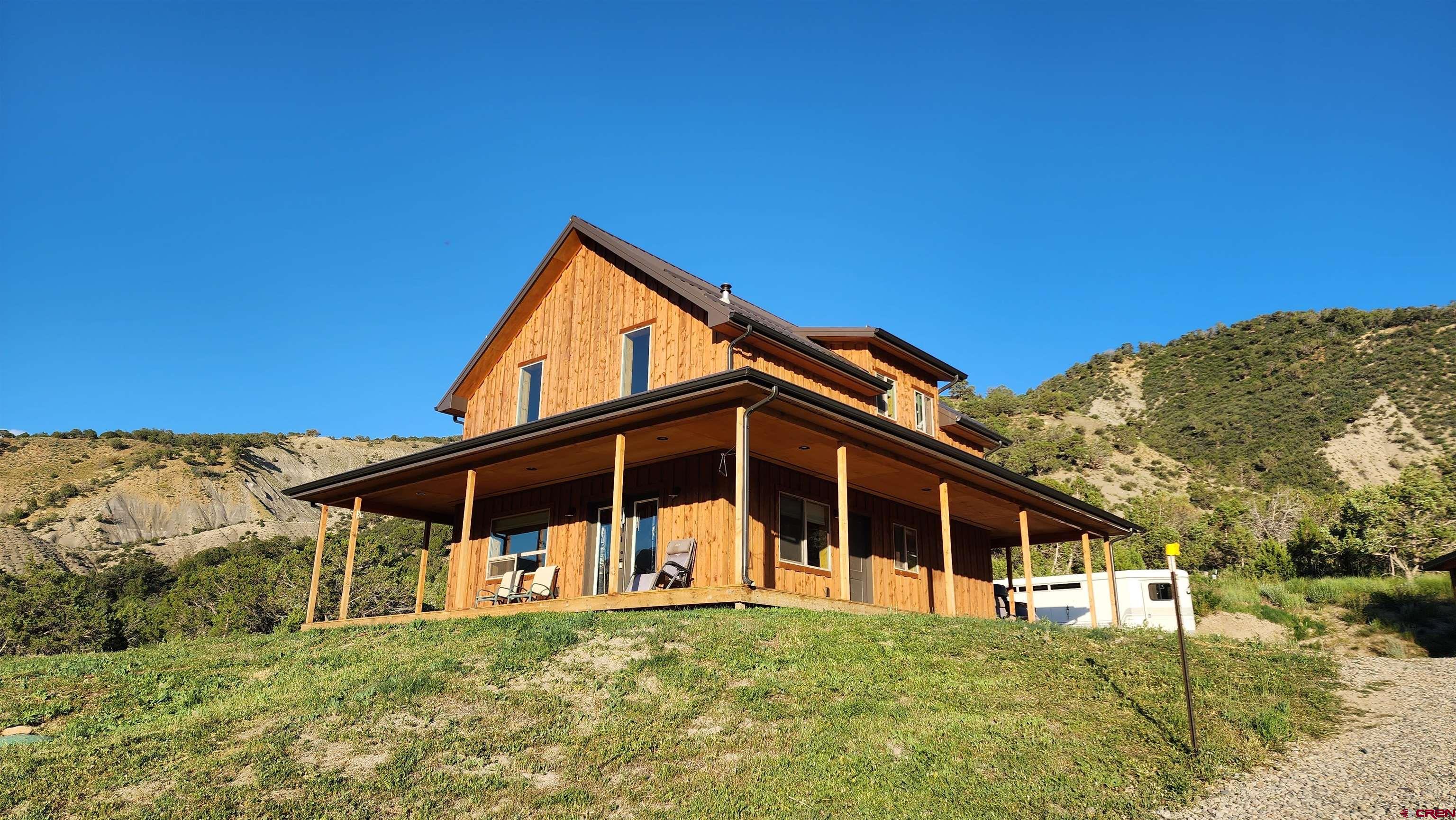 16800 Grange Road Paonia, CO 81428 - Photo 23 of 38 a front view of a house with a yard