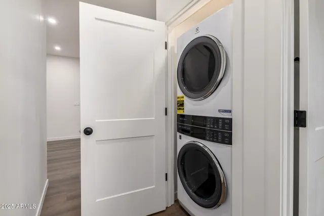 a view of a hallway with washer and dryer