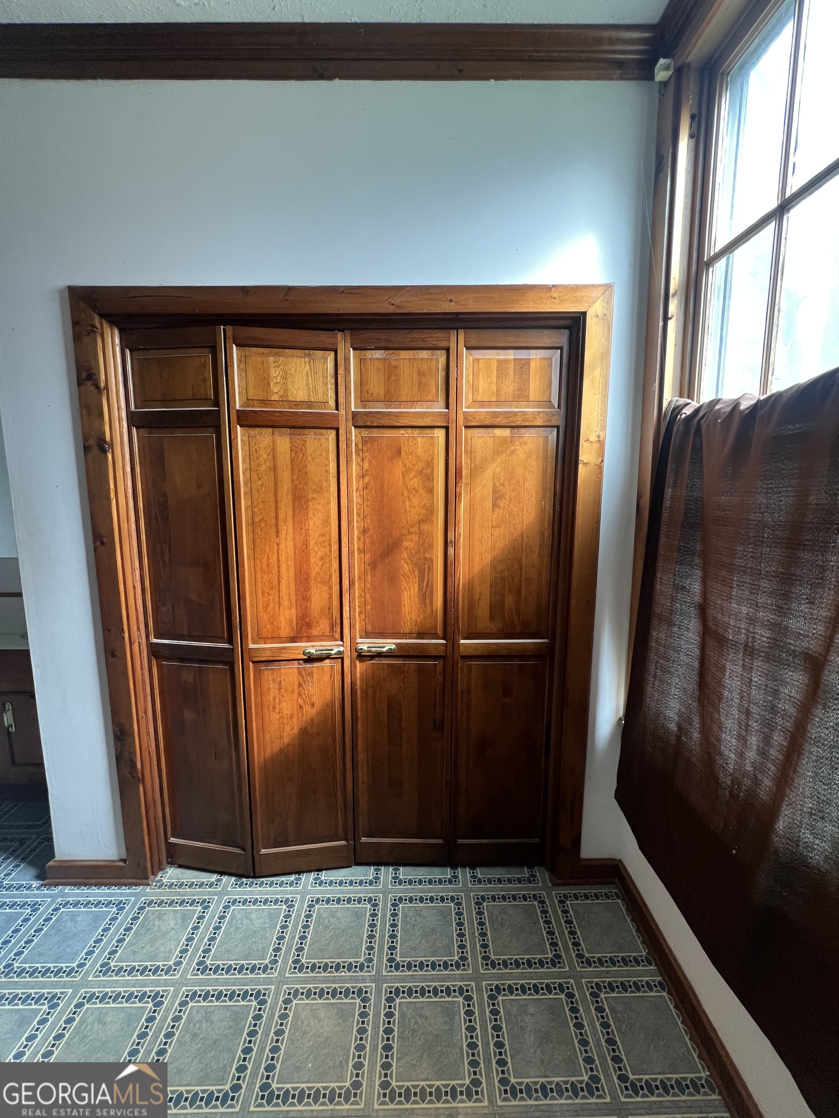 179 Independence Street Tignall, GA 30668 - Photo 12 of 21 a view of empty room with wooden floor and large window