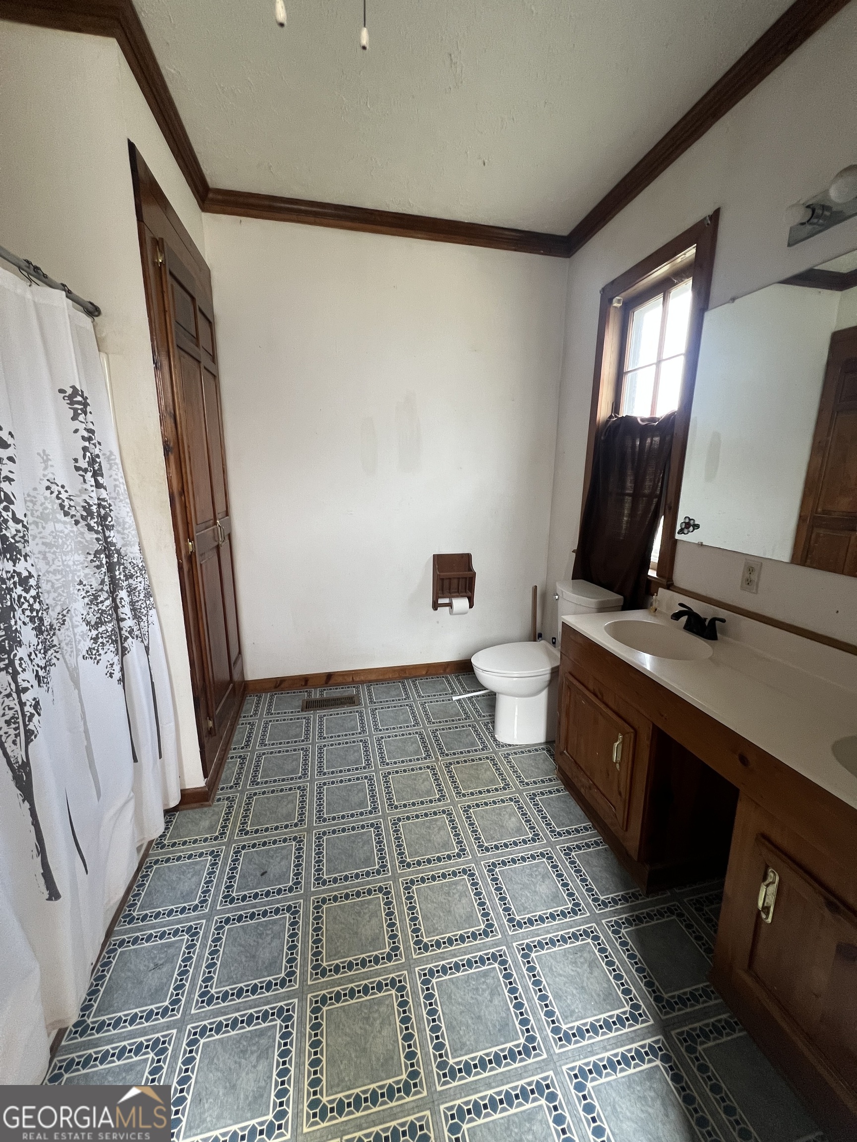 179 Independence Street Tignall, GA 30668 - Photo 13 of 21 a bathroom with a sink and a mirror
