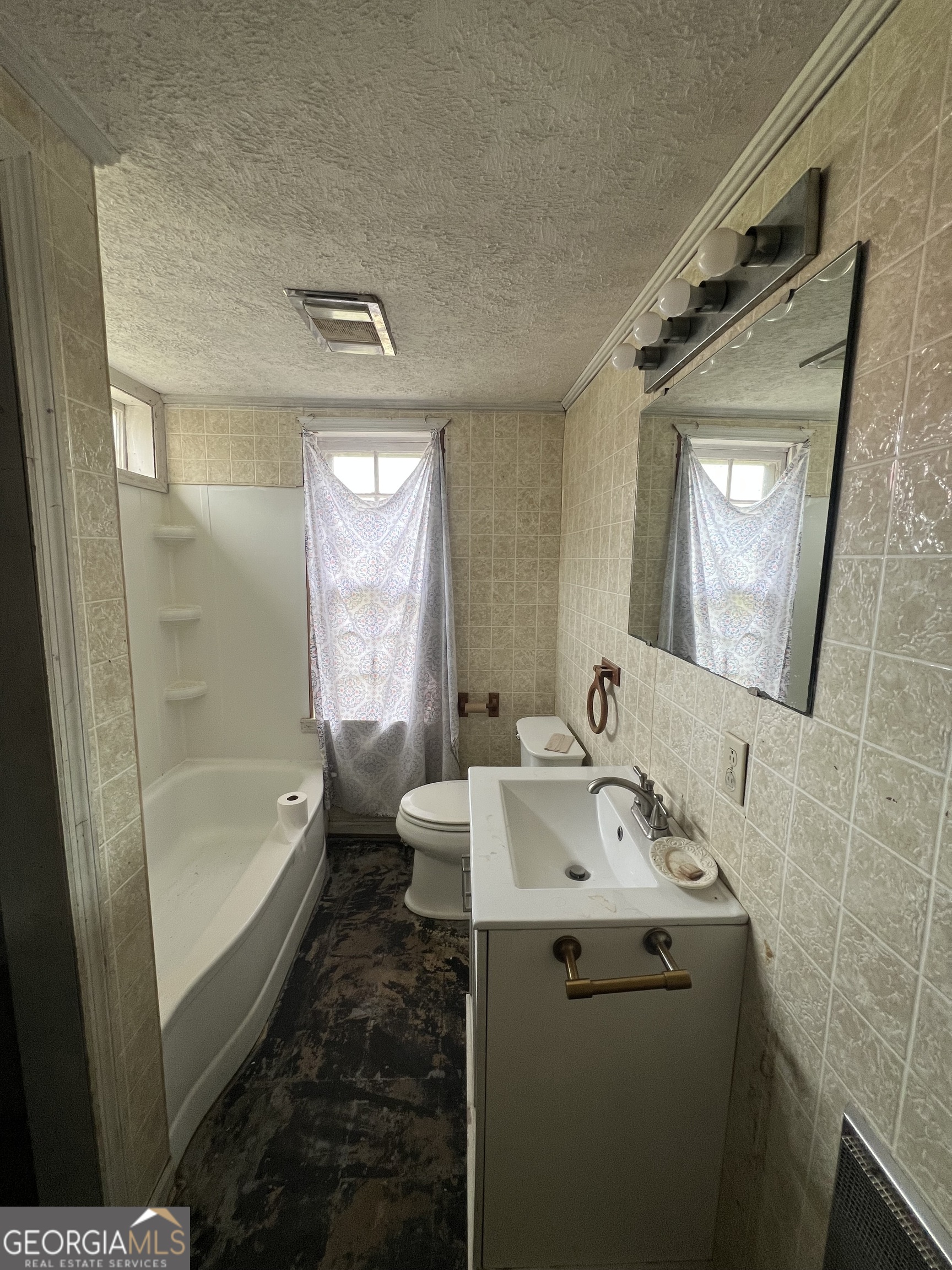 179 Independence Street Tignall, GA 30668 - Photo 15 of 21 a bathroom with a sink a toilet and shower