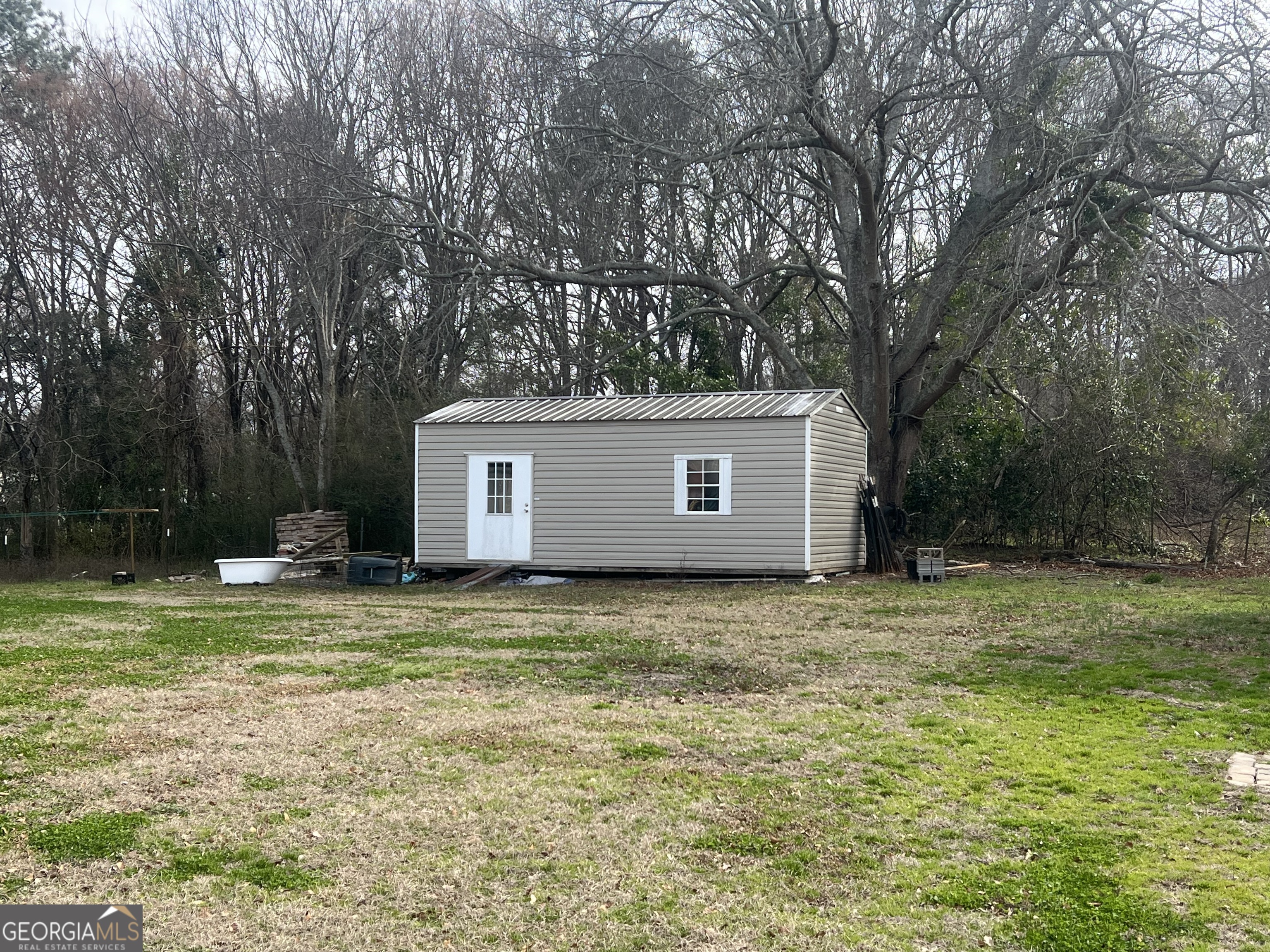 179 Independence Street Tignall, GA 30668 - Photo 19 of 21 a view of a house with a yard