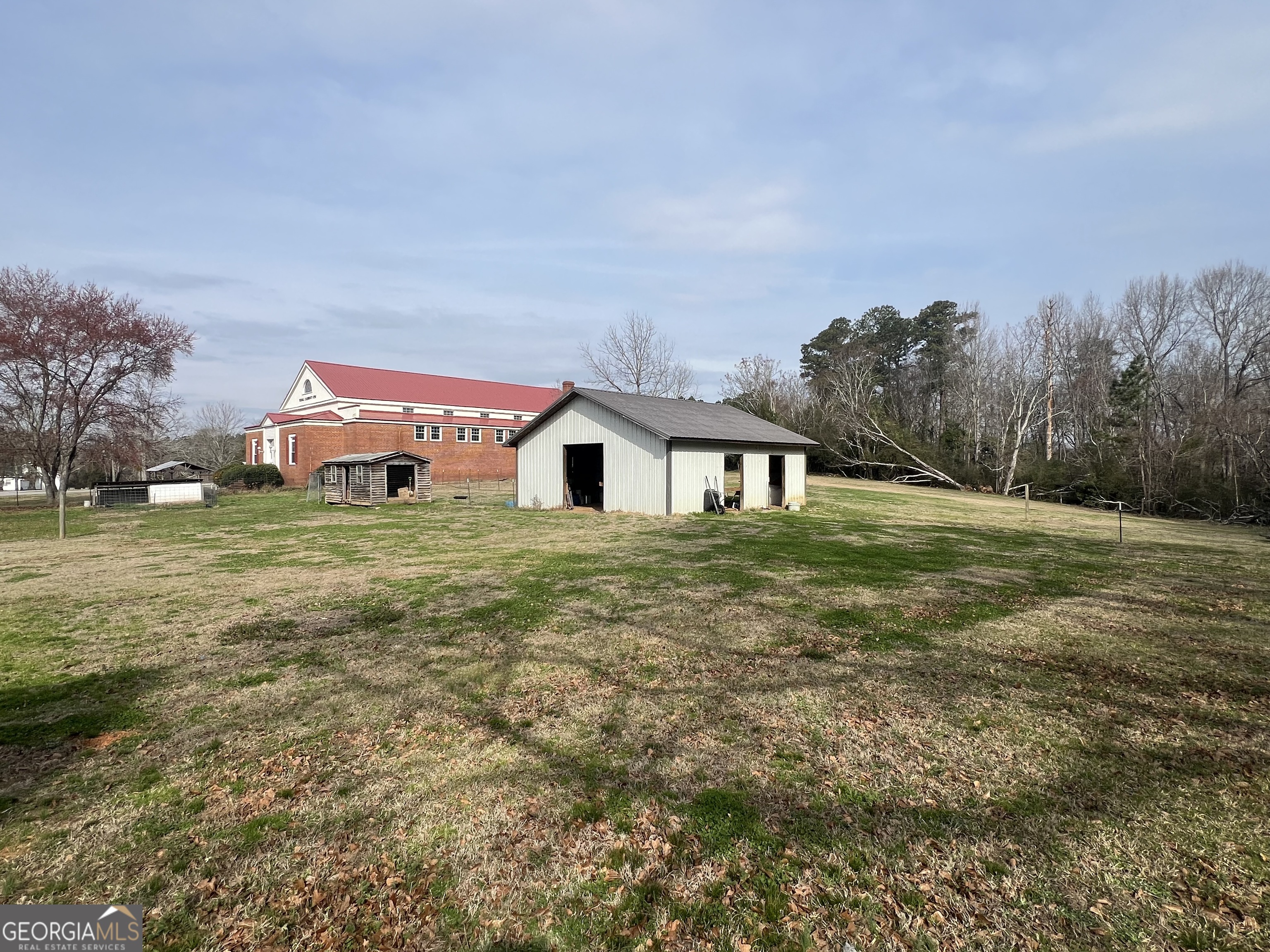 179 Independence Street Tignall, GA 30668 - Photo 20 of 21 a view of a house with a yard