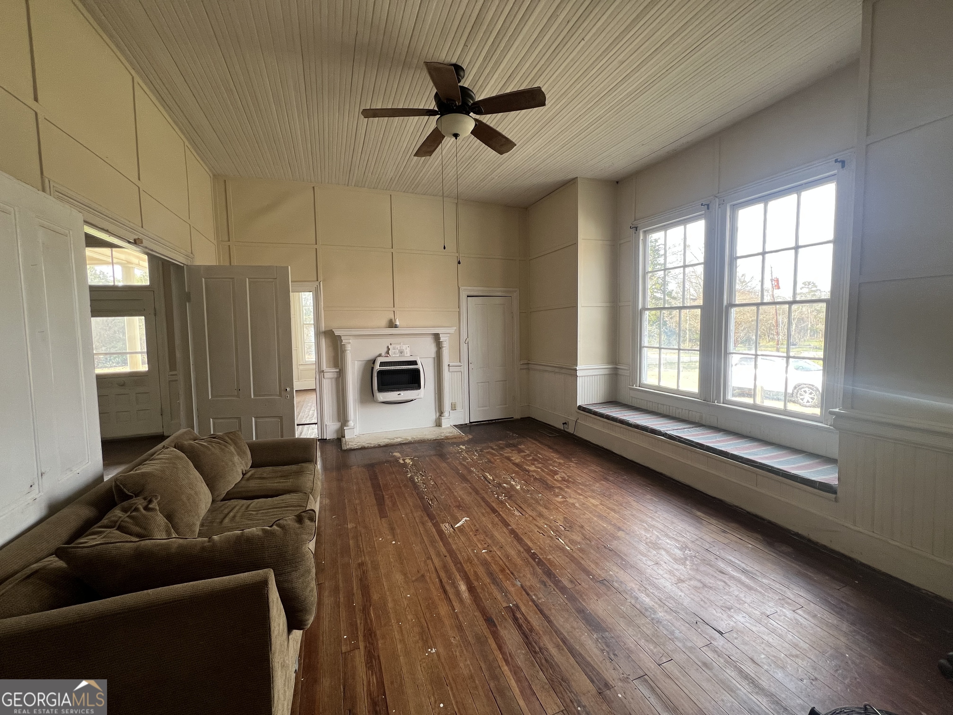 179 Independence Street Tignall, GA 30668 - Photo 5 of 21 a living room with furniture and a fireplace