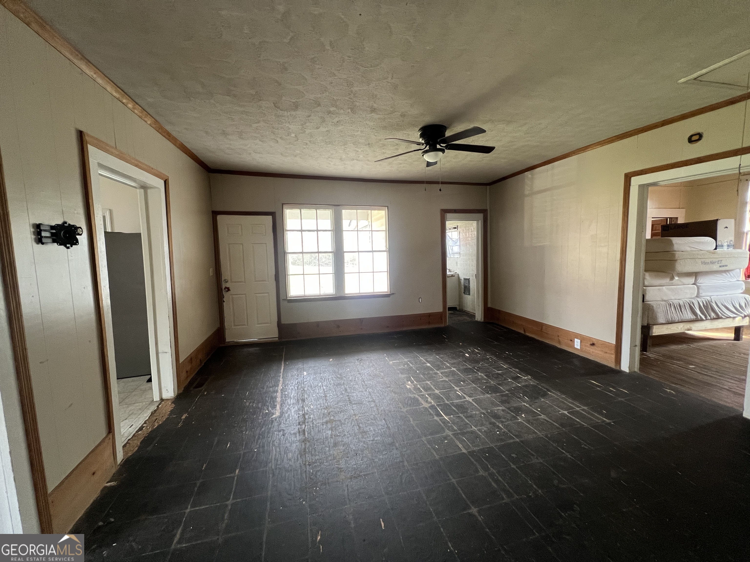 179 Independence Street Tignall, GA 30668 - Photo 9 of 21 an empty room with wooden floor and windows