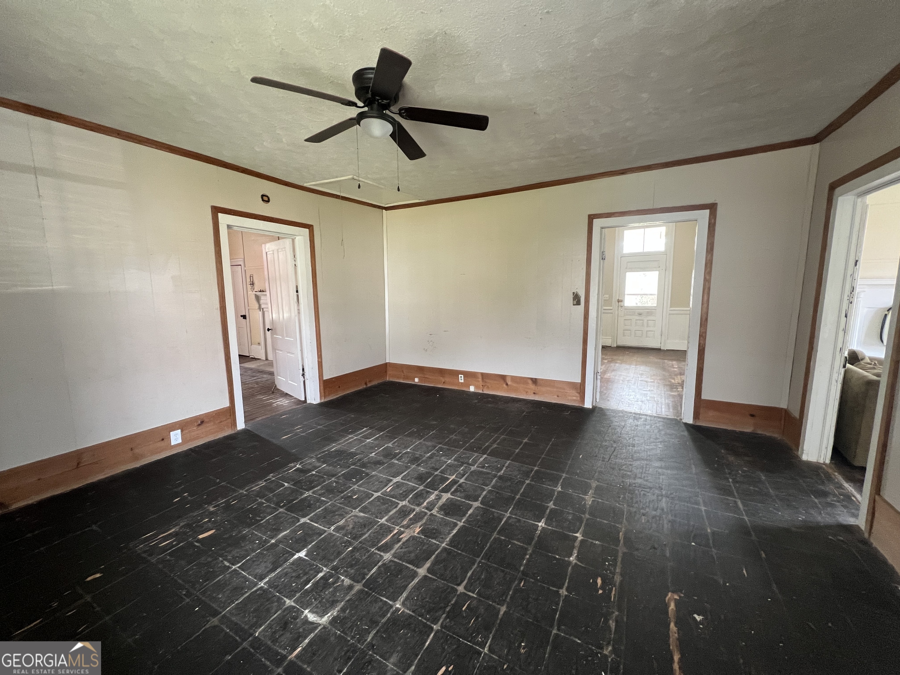 179 Independence Street Tignall, GA 30668 - Photo 10 of 21 a view of empty room with wooden floor and fan
