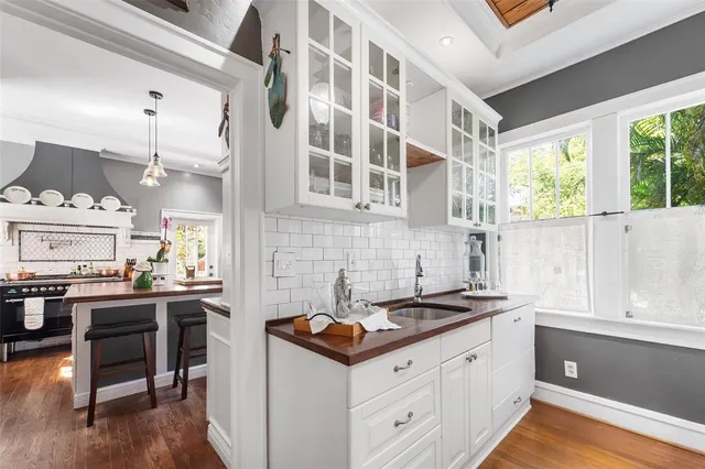 a kitchen with stainless steel appliances granite countertop a stove and a sink