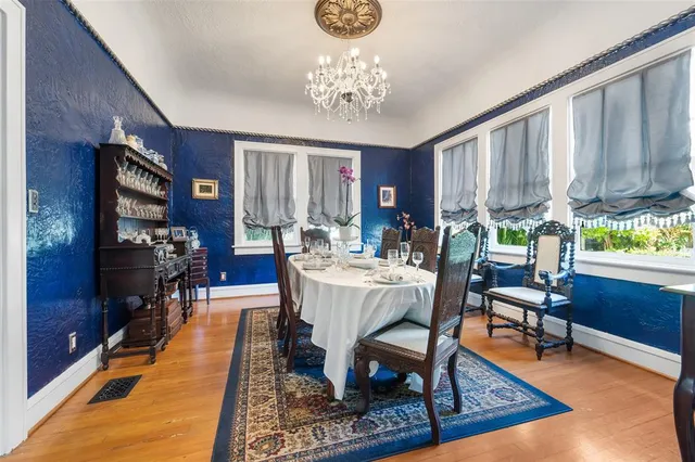a living room with furniture a rug and a chandelier
