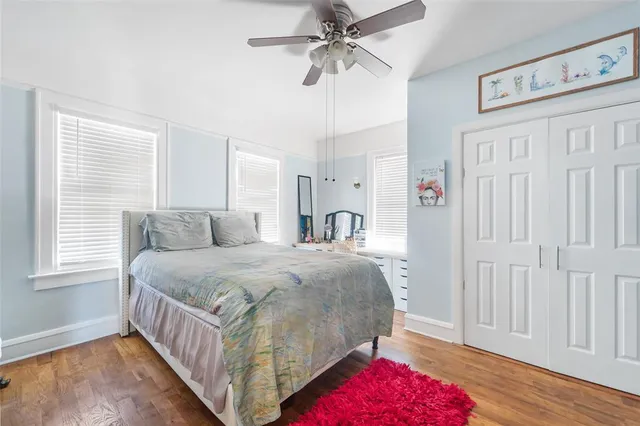 a bed room with a bed and a chandelier