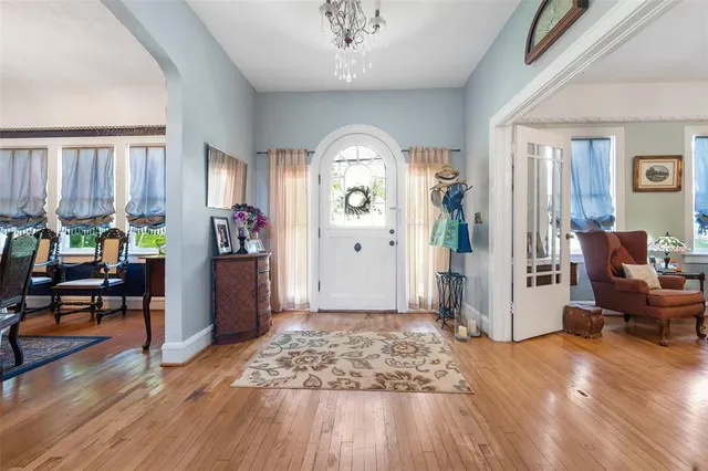 a view of living room filled with furniture and wooden floor