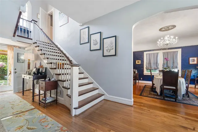a view of a livingroom with furniture and stairs