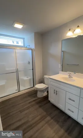 a bathroom with a sink and vanity