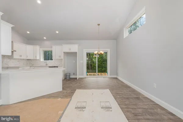 a view of a living room and kitchen