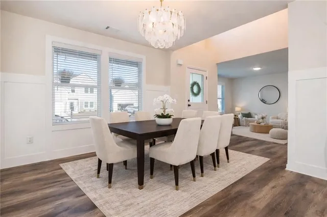 a view of a dining room with furniture window and wooden floor