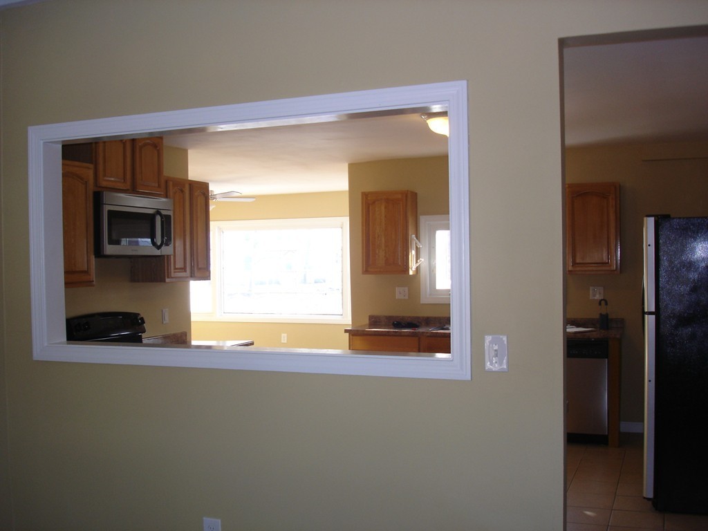 1 Lancaster Road Shirley, MA 01464 - Photo 22 of 30 a view of an empty room with a fireplace and a window