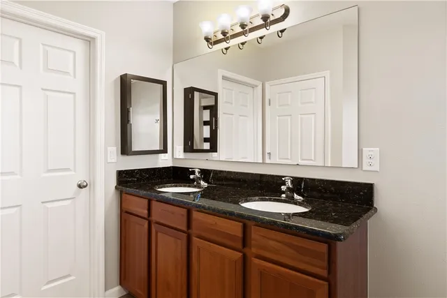 a kitchen with stainless steel appliances a refrigerator stove and sink