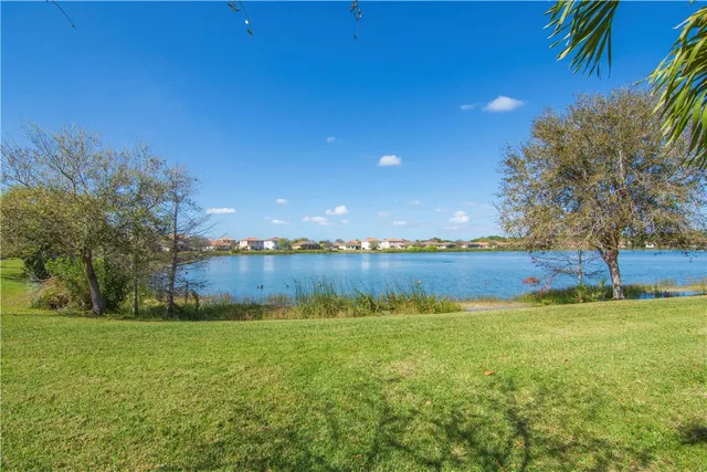 a view of a lake with a yard