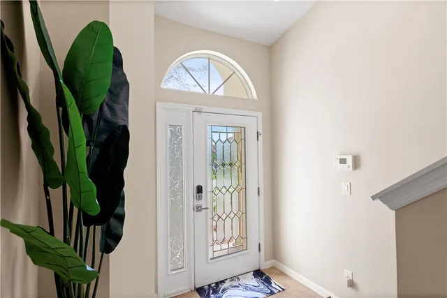 a kitchen with stainless steel appliances granite countertop a refrigerator a stove a sink and a microwave