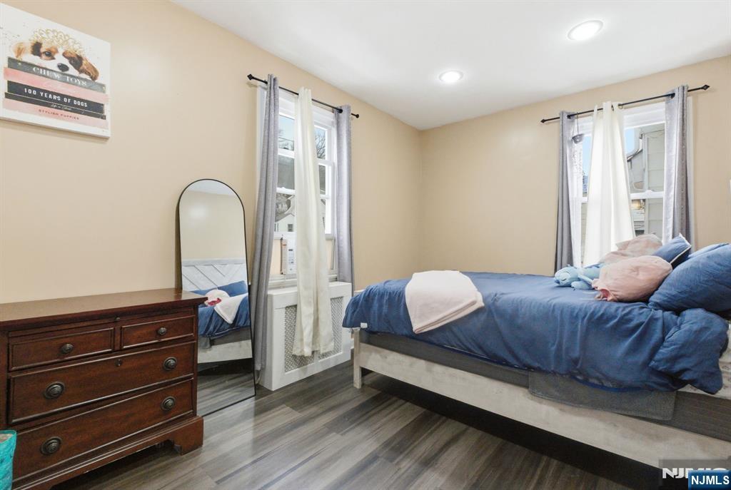 64 John Ryle Avenue Haledon, NJ 07508 - Photo 12 of 44 a bedroom with a bed and wooden floor