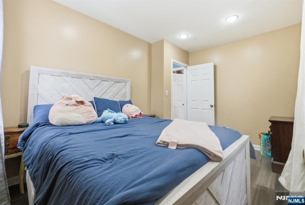 64 John Ryle Avenue Haledon, NJ 07508 - Photo 13 of 44 a bedroom with a bed and a dresser