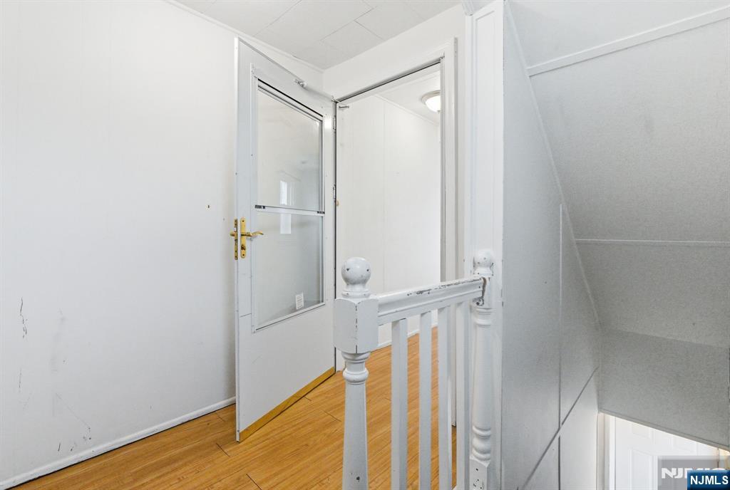 64 John Ryle Avenue Haledon, NJ 07508 - Photo 15 of 44 a view of a small space with wooden floor and closet