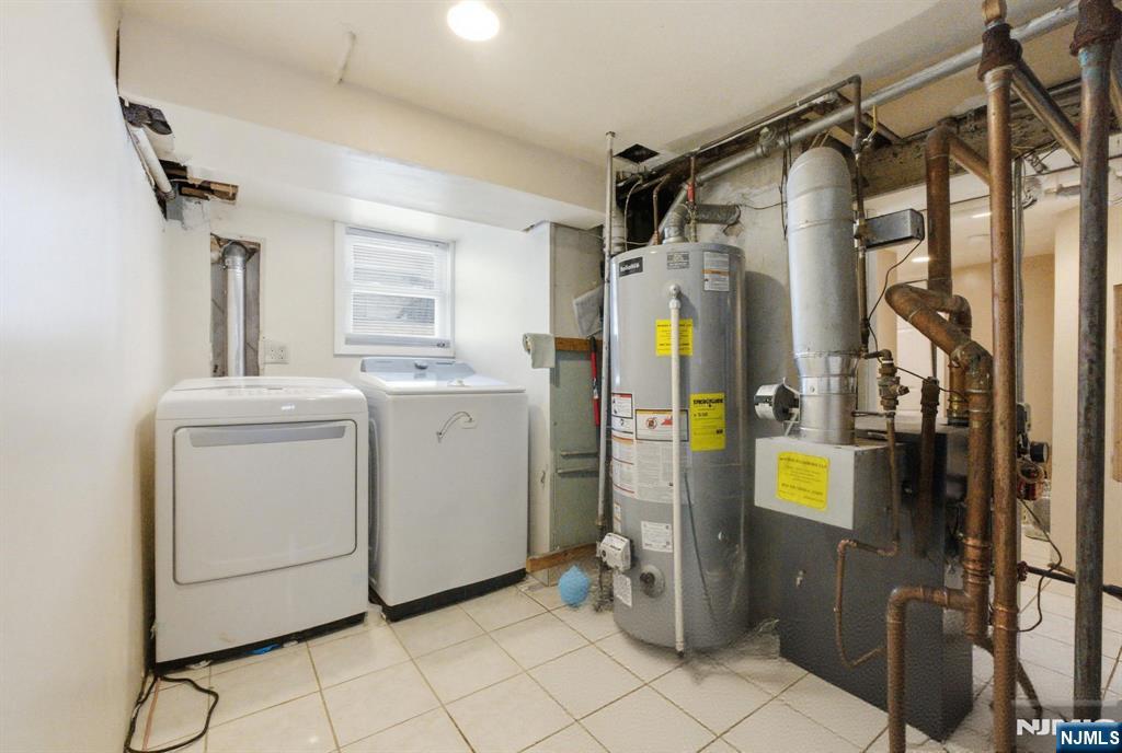 64 John Ryle Avenue Haledon, NJ 07508 - Photo 28 of 44 a utility room with dryer and washer