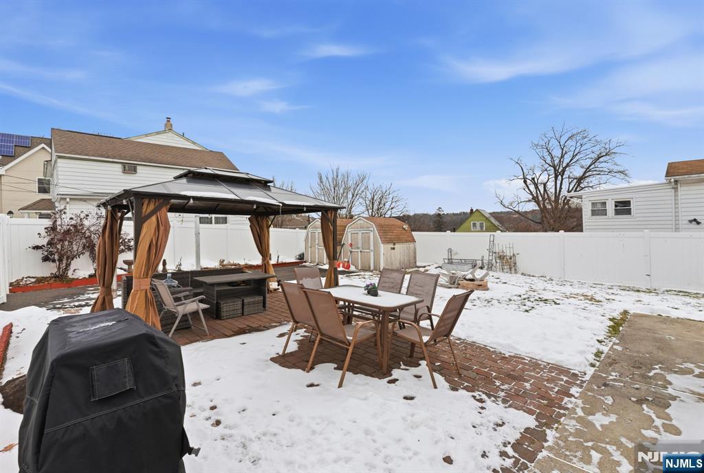 64 John Ryle Avenue Haledon, NJ 07508 - Photo 32 of 44 a view of a lounge chair and table in the patio