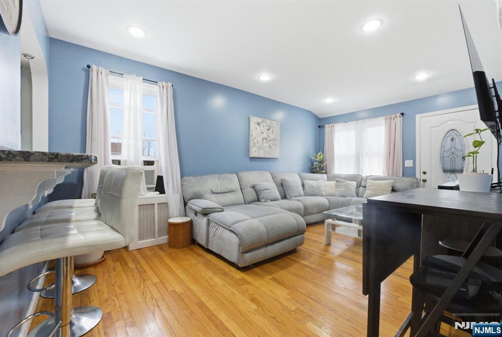 64 John Ryle Avenue Haledon, NJ 07508 - Photo 5 of 44 a living room with furniture and a wooden floor