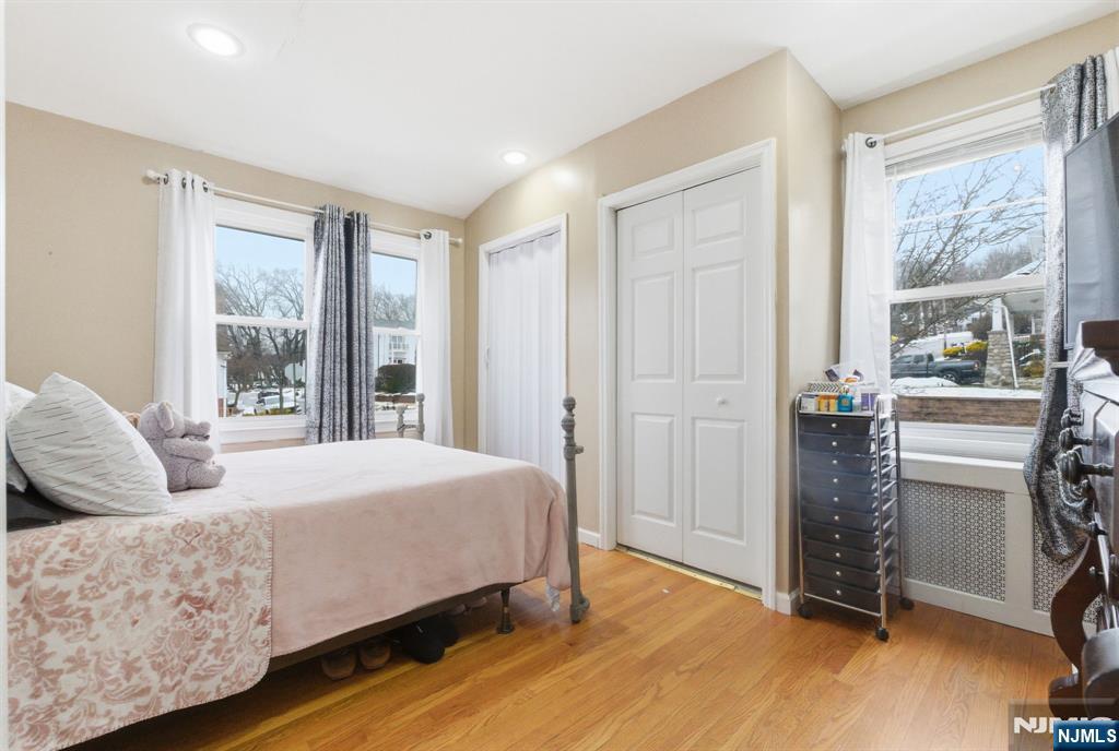 64 John Ryle Avenue Haledon, NJ 07508 - Photo 10 of 44 a bedroom with a bed and a large window