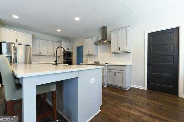 a kitchen with a sink stainless steel appliances and cabinets