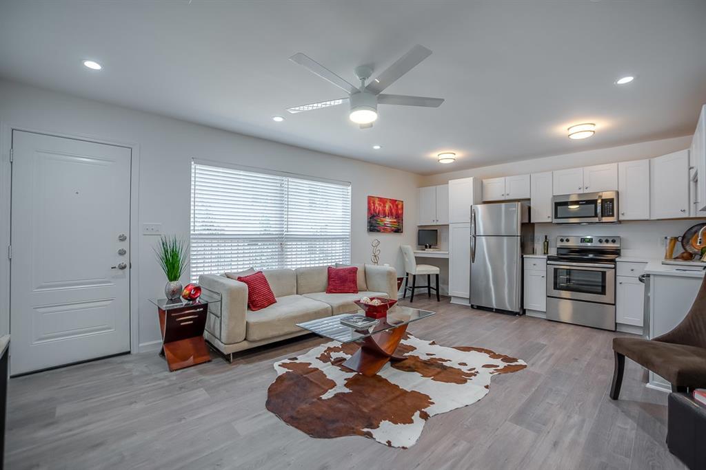 1809 Bennett Avenue, Unit 107 Dallas, TX 75206 - Photo 1 of 1 Living room featuring light hardwood / wood-style floors and ceiling fan